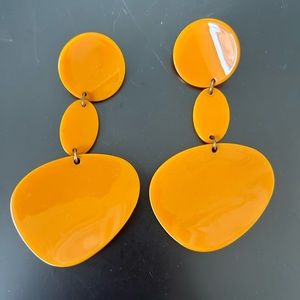 Orange geometric dangly earrings